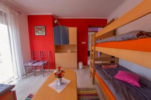 Postel nebo postele na pokoji v ubytování Guesthouse Adi