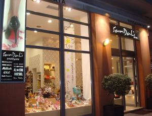 a store front of a store with a large window at Marine House Andrianna -Adults only in Siviri