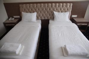 Postel nebo postele na pokoji v ubytování Hotel Khanaka