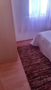 Кровать или кровати в номере Gala Apartments