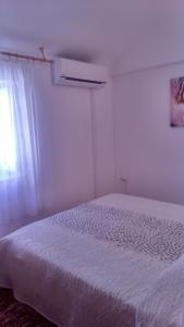 Кровать или кровати в номере Gala Apartments