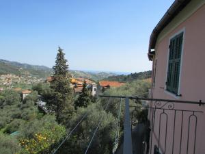 a balcony with a view of a city at Casa Antica Rosetta in Dolcedo