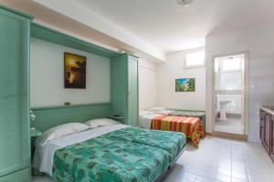 Ένα ή περισσότερα κρεβάτια σε δωμάτιο στο Villaggio Club Degli Ulivi +87 φωτογραφίες