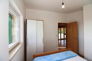 Postel nebo postele na pokoji v ubytování Holliday home Robinson Tourism Maria