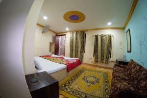 Łóżko lub łóżka w pokoju w obiekcie Hotel Desert