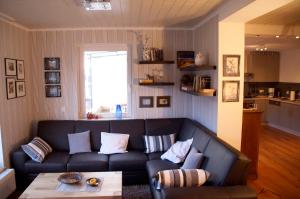 a living room with a couch and a table at be Clemense in Sankt Aldegund