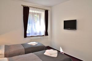 TV a/nebo společenská místnost v ubytování Hotel Sonata