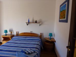 A bed or beds in a room at Piccola Perla A Livo