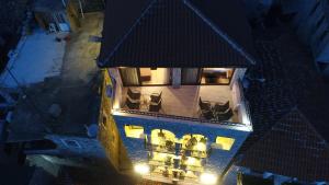 an aerial view of a building with a balcony at night at Apartments Timoni in Ulcinj