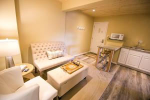 a living room with a couch and a table at Crystal Springs Lodge in Radium Hot Springs