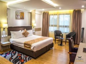 Postel nebo postele na pokoji v ubytování The Ole-Ken Hotel + 37 fotografií