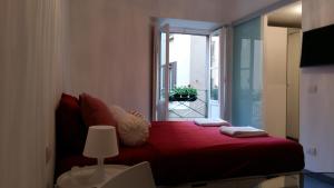 Tempat tidur dalam kamar di La Marina di Milano