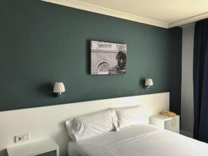 Postel nebo postele na pokoji v ubytování Hotel Gran Regente