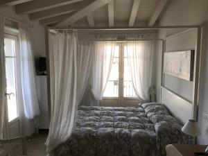 Postel nebo postele na pokoji v ubytování Hotel La Primula