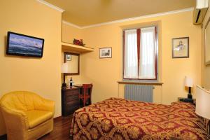 Postel nebo postele na pokoji v ubytování Hotel Bonconte