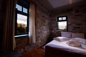 Posteľ alebo postele v izbe v ubytovaní Gaia Guesthouse
