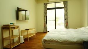 A bed or beds in a room at Warm Home