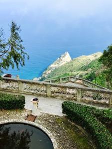 a view of the ocean from the top of a building at TAORMINA - The Godfathers Little Mansion in Forza dʼAgro