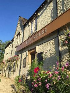 a building with a sign that reads bell huber house at The Bell House in Sutton Benger