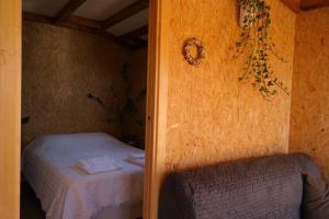 Ένα ή περισσότερα κρεβάτια σε δωμάτιο στο Casa Batucela
