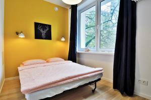 Posteľ alebo postele v izbe v ubytovaní Apartments City Center Warsaw by Noclegi Renters