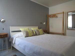מיטה או מיטות בחדר ב-Casa Flor d'Sal