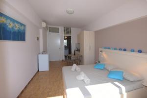 Ένα ή περισσότερα κρεβάτια σε δωμάτιο στο Horizon View Studio