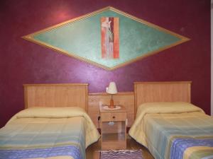 Cama ou camas em um quarto em O Lar de Carmiña