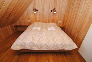 Postel nebo postele na pokoji v ubytování Šeimos Vila