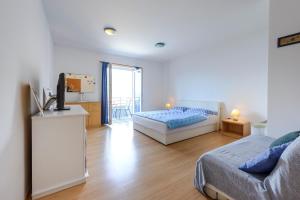 Posteľ alebo postele v izbe v ubytovaní Apartments Red Coral Cavtat