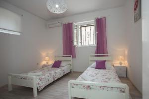Posteľ alebo postele v izbe v ubytovaní Summer Bay Apartments