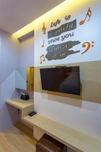 TV/trung tâm giải trí tại OneLoft Hotel