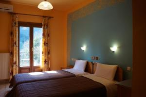 Postel nebo postele na pokoji v ubytování Guesthouse Papastathis
