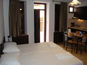 Ένα ή περισσότερα κρεβάτια σε δωμάτιο στο Old Town Apartments