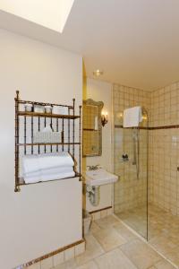 a bathroom with a shower and a sink at Hotel Sausalito in Sausalito