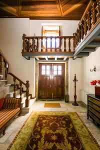 
a living room filled with furniture and a staircase at Casa da Fidalga - Villa of 5 bedrooms in Outeiro de Gatos
