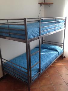 Postel nebo postele na pokoji v ubytování Vecchia Filanda Musso 1A