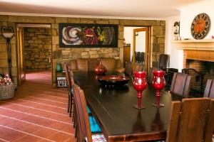 
a living room filled with furniture and a fireplace at Casa da Fidalga - Villa of 5 bedrooms in Outeiro de Gatos
