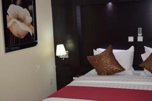 Uma cama ou camas num quarto em Citiheight Hotel