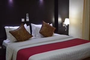 Uma cama ou camas num quarto em Citiheight Hotel