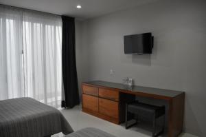 TV a/nebo společenská místnost v ubytování AMD Hotel
