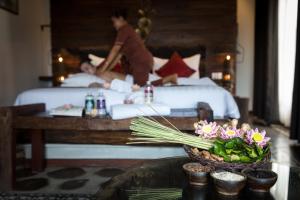 Giường trong phòng chung tại Khmer Paradise Villa