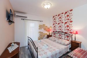 En eller flere senge i et værelse på Apartments Antonio