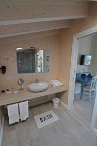 a bathroom with a sink and a mirror at B&B La Fiaba in Sirmione