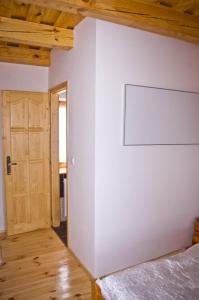 A bed or beds in a room at Harmatcsepp-Vendégház
