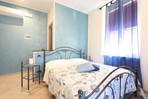 Кровать или кровати в номере La Rosa Dei Venti