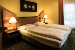 Letto o letti in una camera di Hotel Sperling mit E-Ladestation
