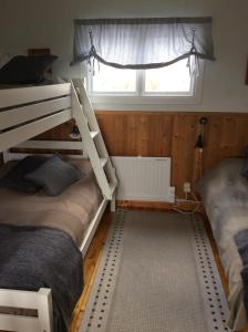 Postel nebo postele na pokoji v ubytování Lillstugan