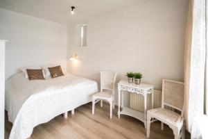 Postel nebo postele na pokoji v ubytování River Apartments