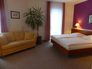 Ein Bett oder Betten in einem Zimmer der Unterkunft Hotel Dorotheenhof